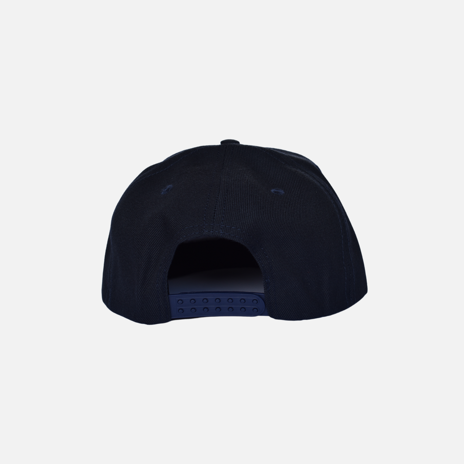 Back close up of Swing Golf Apparel navy snap back cap with Puff Embroidery