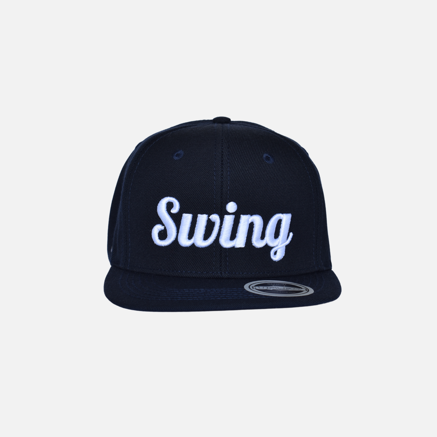 Front close up of Swing Golf Apparel navy snap back cap with Puff Embroidery