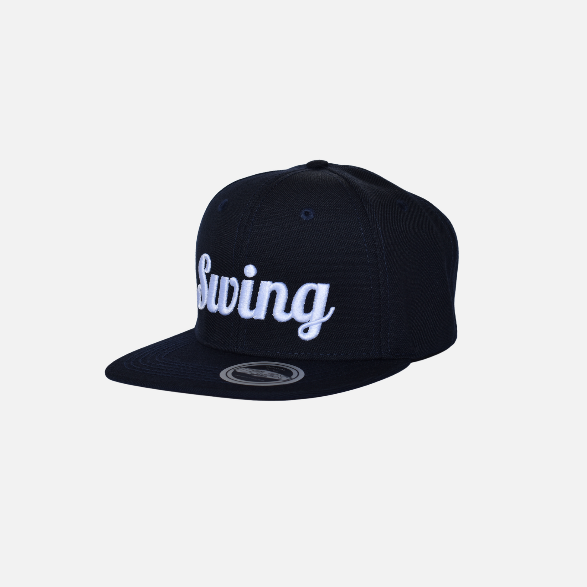 Side close up of Swing Golf Apparel navy snap back cap with Puff Embroidery